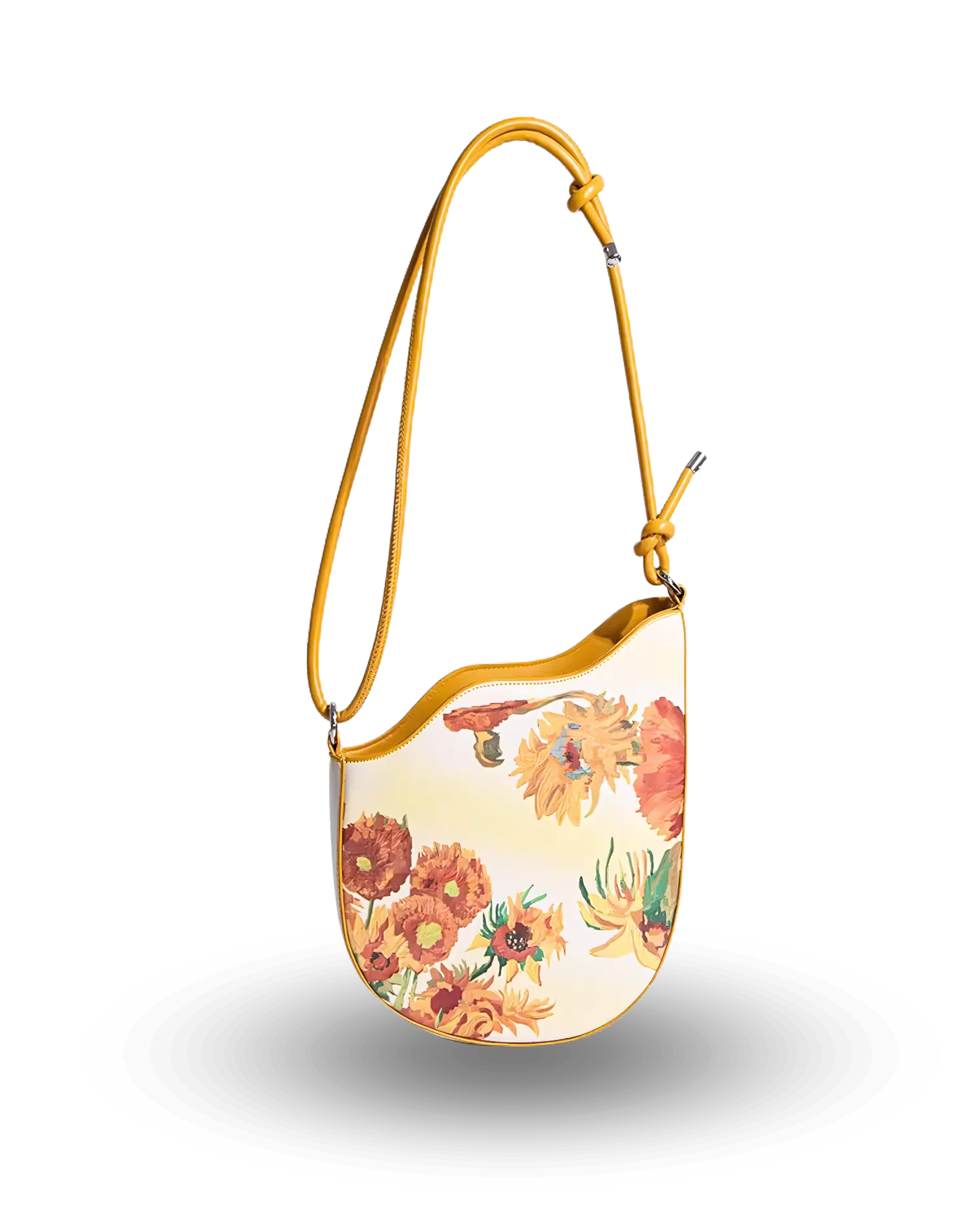 Cream shoulder bag with vibrant sunflower print, curved top edge, and adjustable mustard-yellow strap with knotted detail.