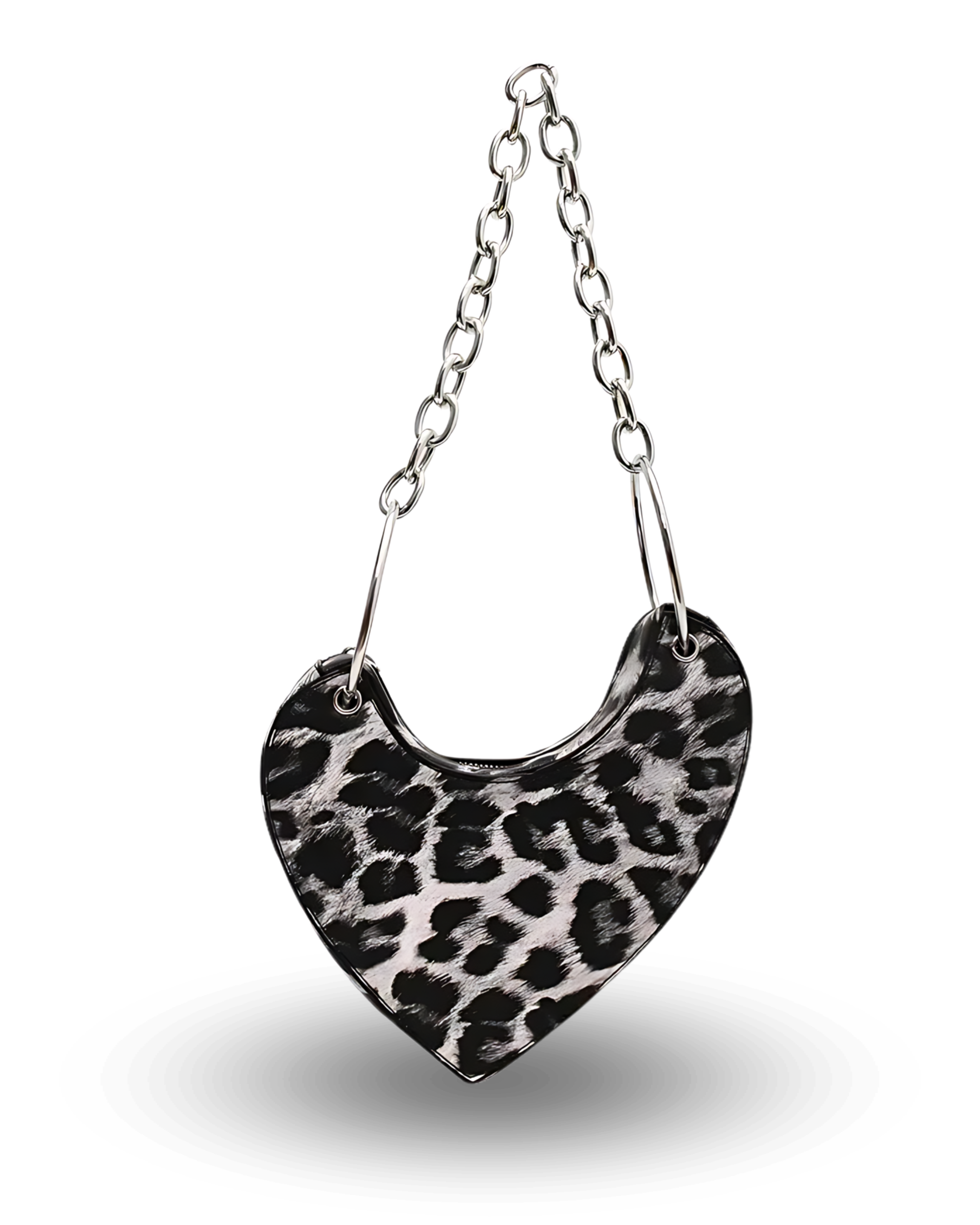 Black and white leopard print heart-shaped handbag with chunky silver chain strap, asymmetrical saddle design, and bold edgy style perfect for night outs or statement fashion looks.