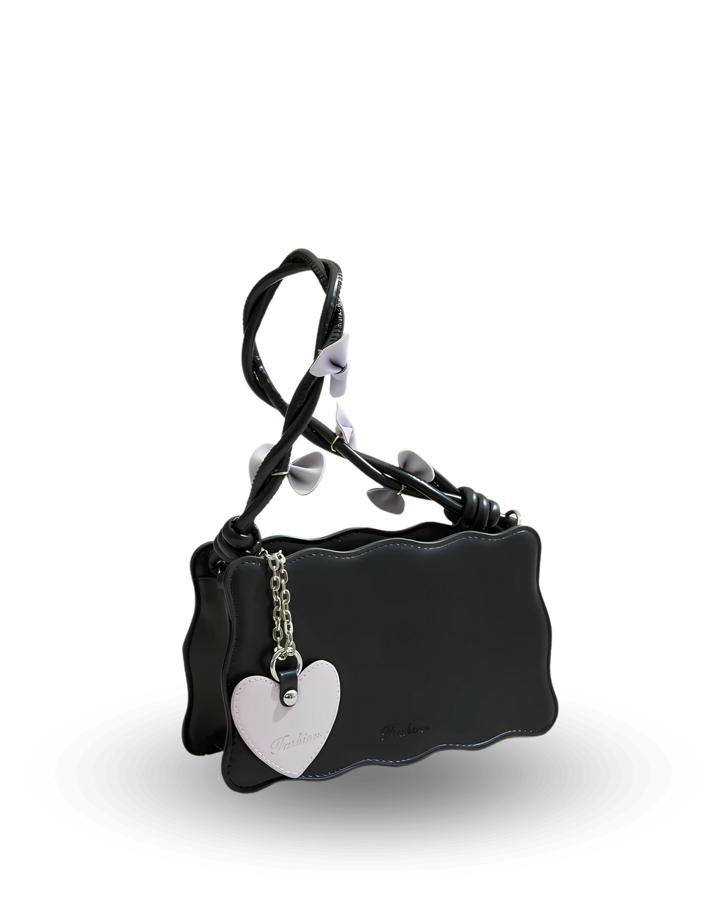 Black handbag with scalloped edges, twisted handle decorated with lavender bows, and heart-shaped charm accent.