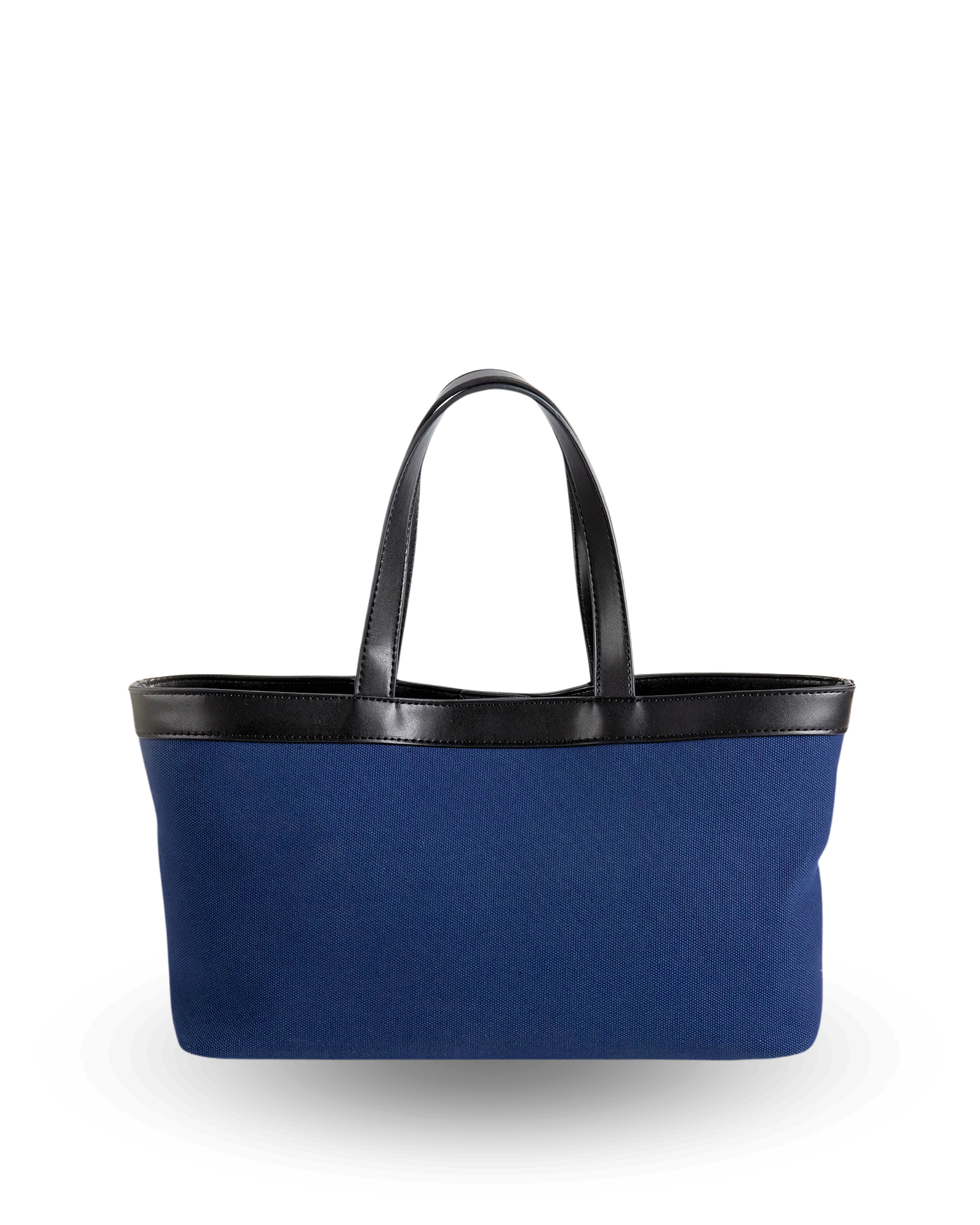 Rectangular navy canvas tote with a flat base, straight structured sides, and black vegan leather trim along the top edge, finished with short dual handles for a sleek, classic silhouette.