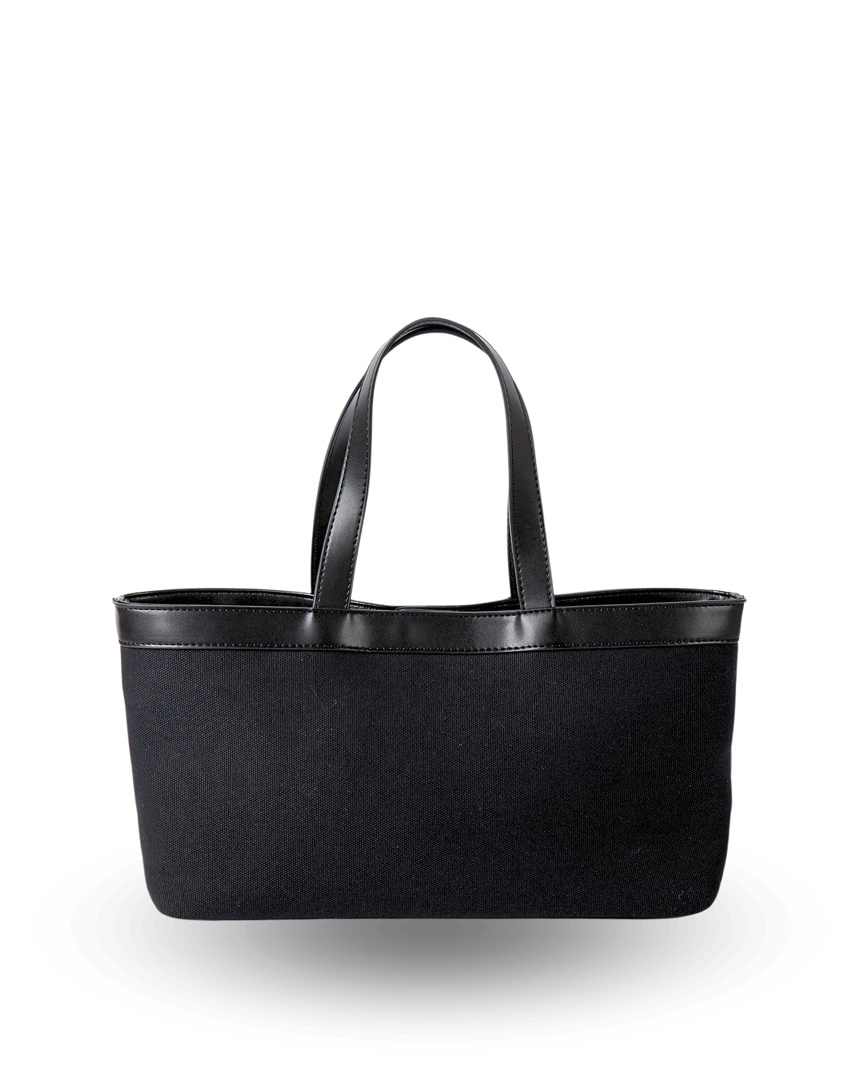 Rectangular black canvas tote with a flat base, straight structured sides, and black vegan leather trim along the top edge, finished with short dual handles for a sleek, classic silhouette.