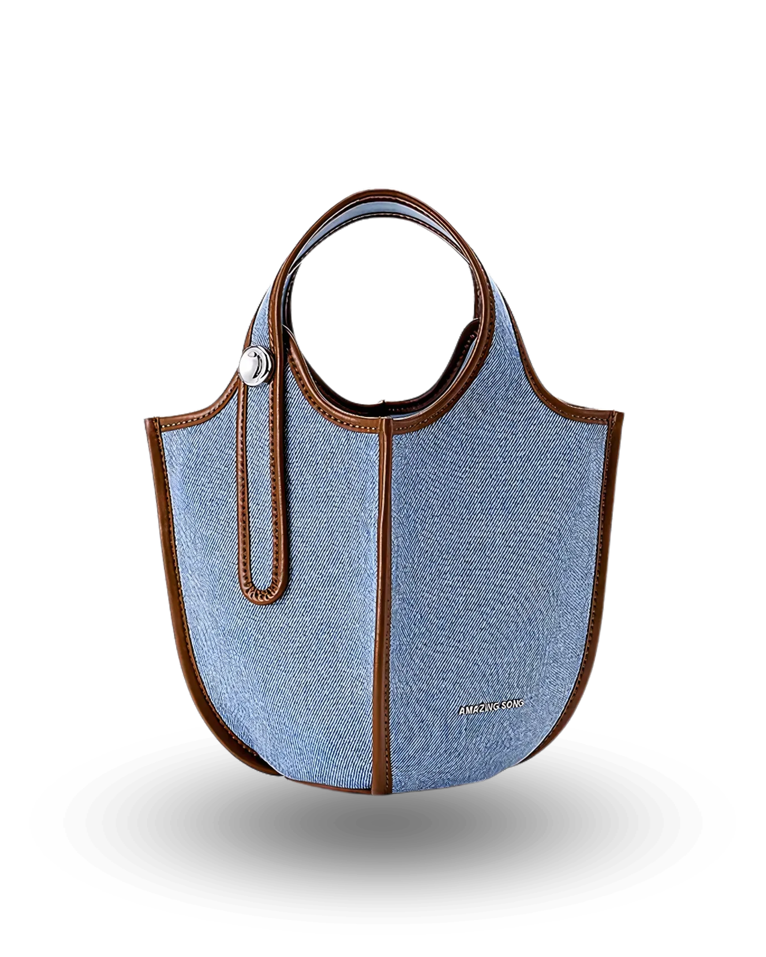 Blue denim bucket handbag with brown leather trim, round top handles, and structured silhouette.