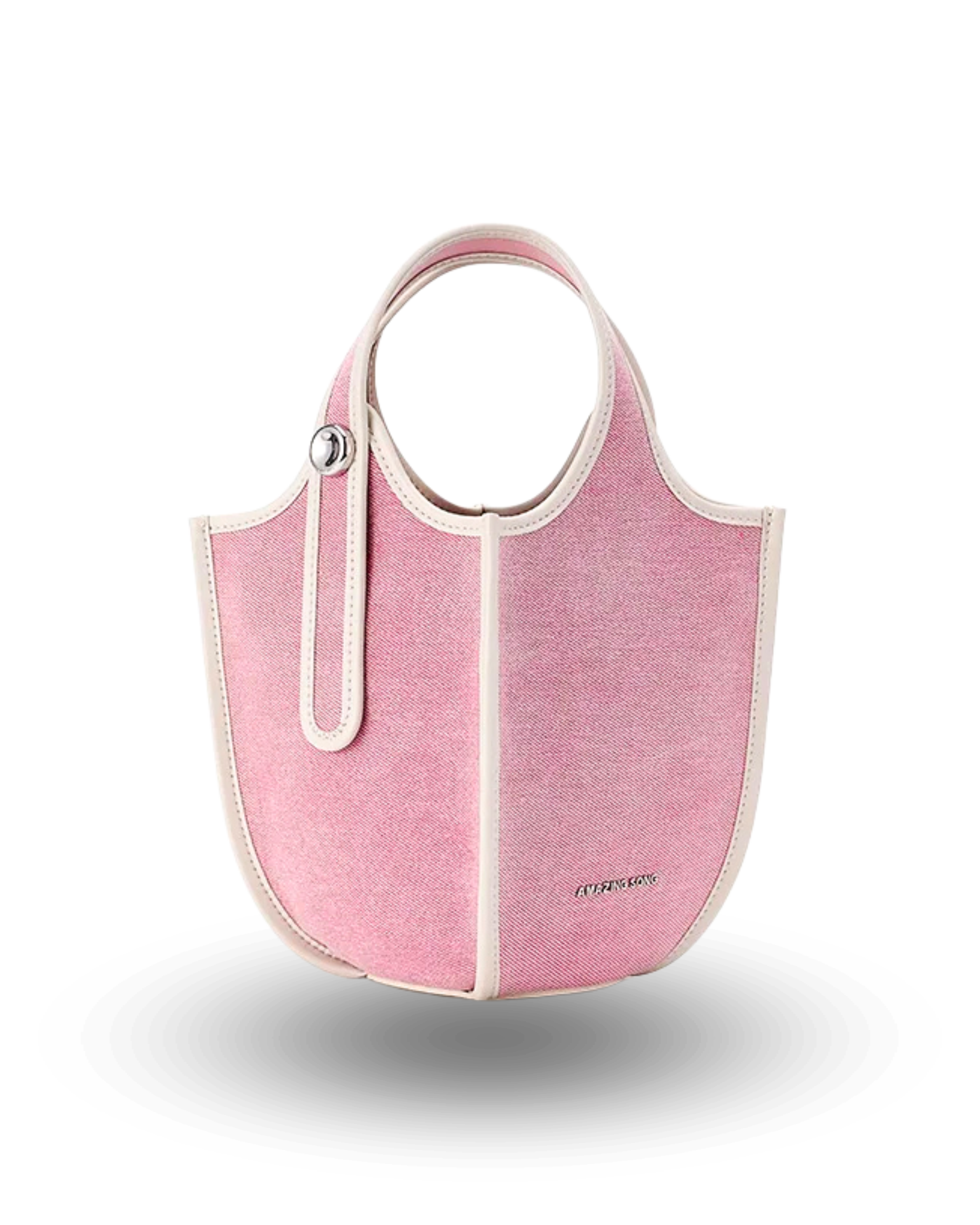 Pink canvas bucket handbag with cream contrast trim, round top handles, and structured design.
