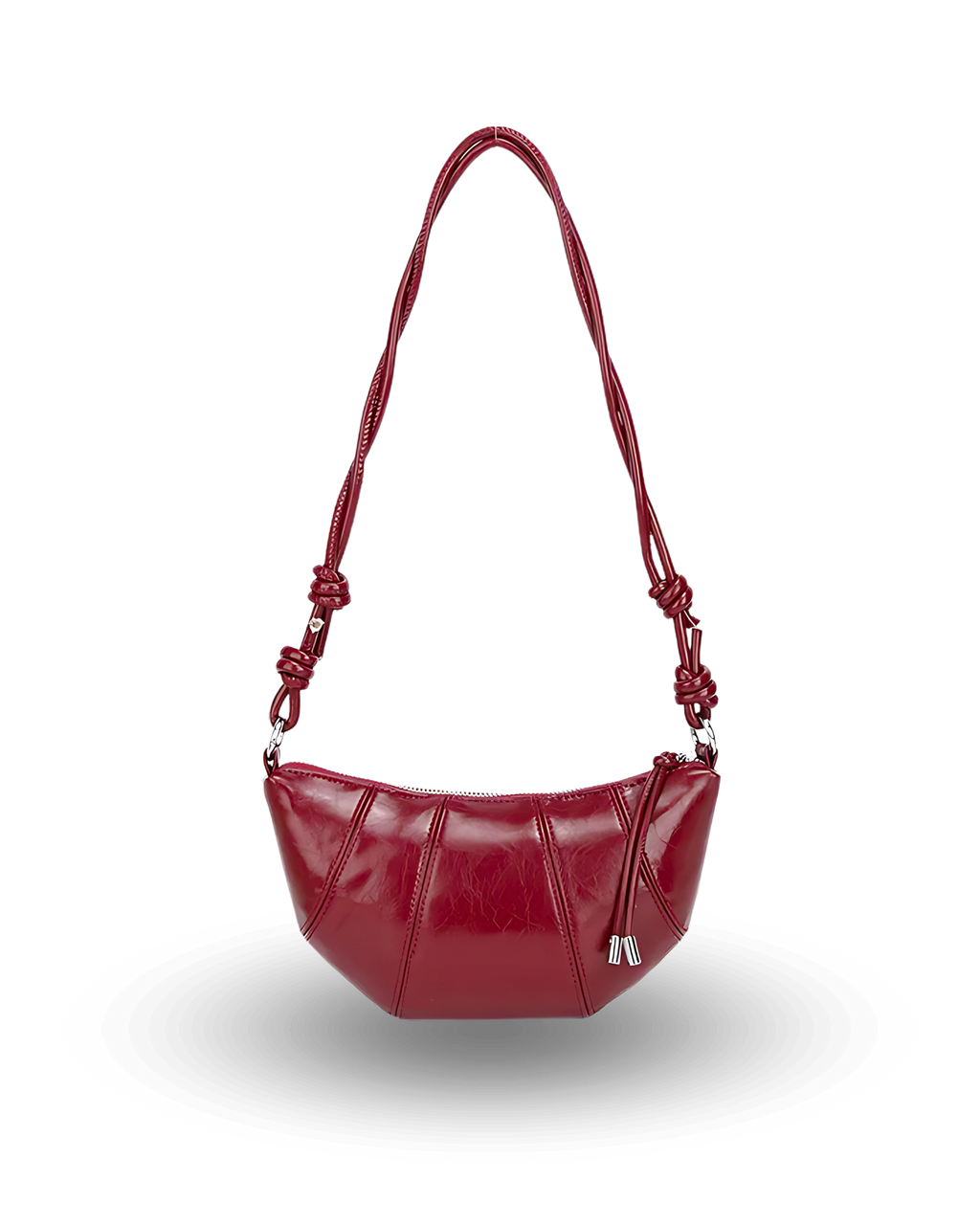 Red handbag with a braided handle on a white background