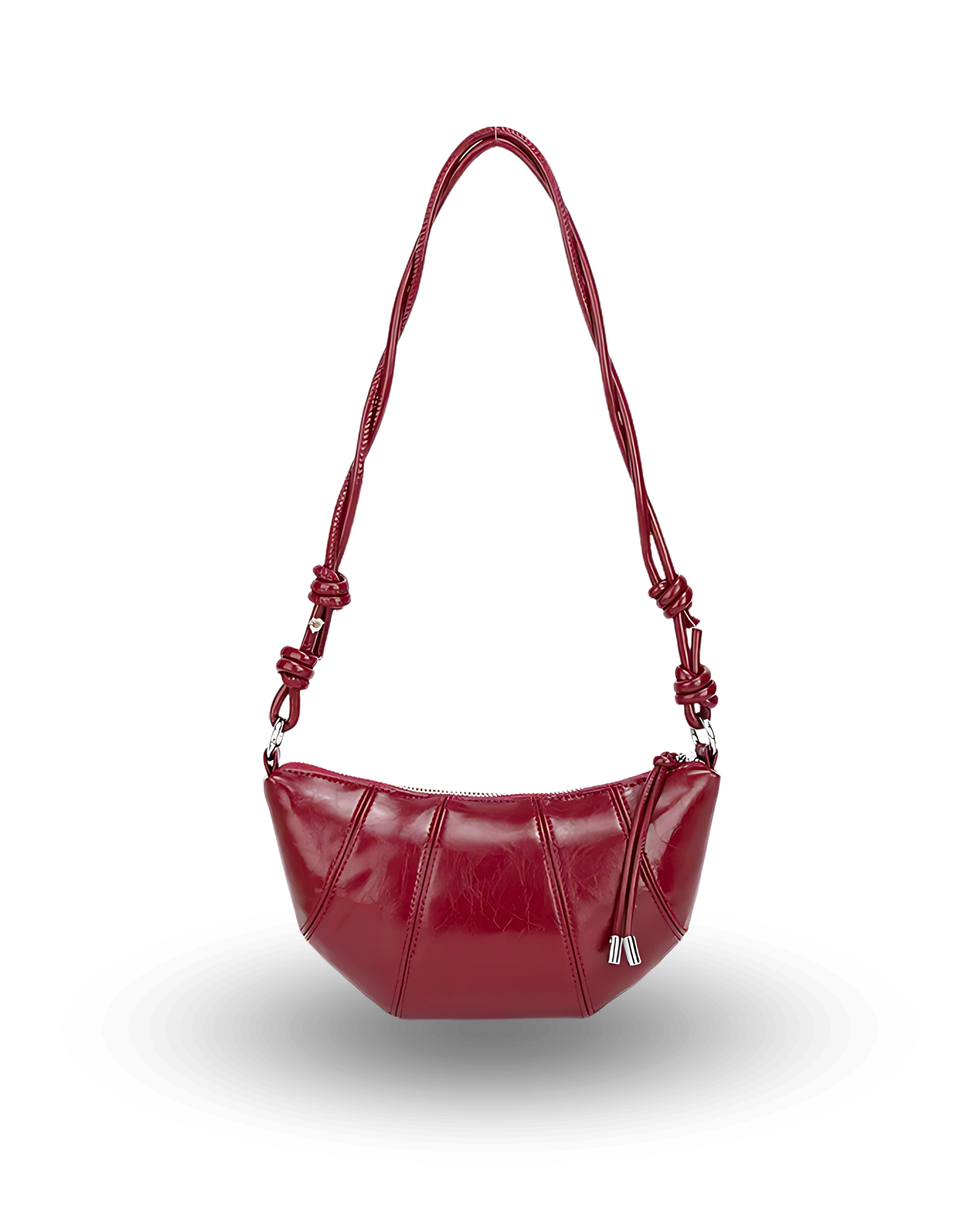 Red handbag with a braided handle on a white background