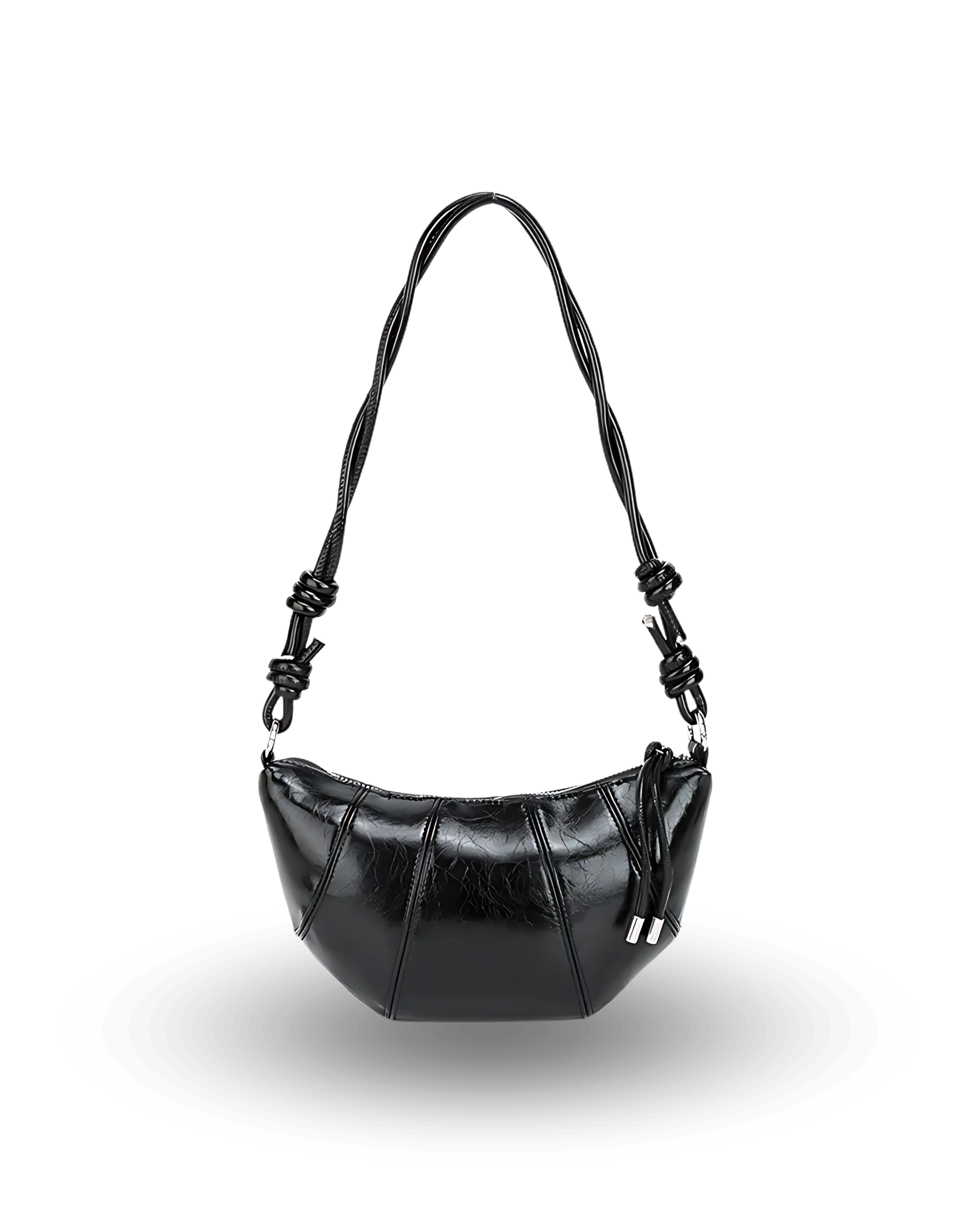 Black handbag with braided handle on a white background