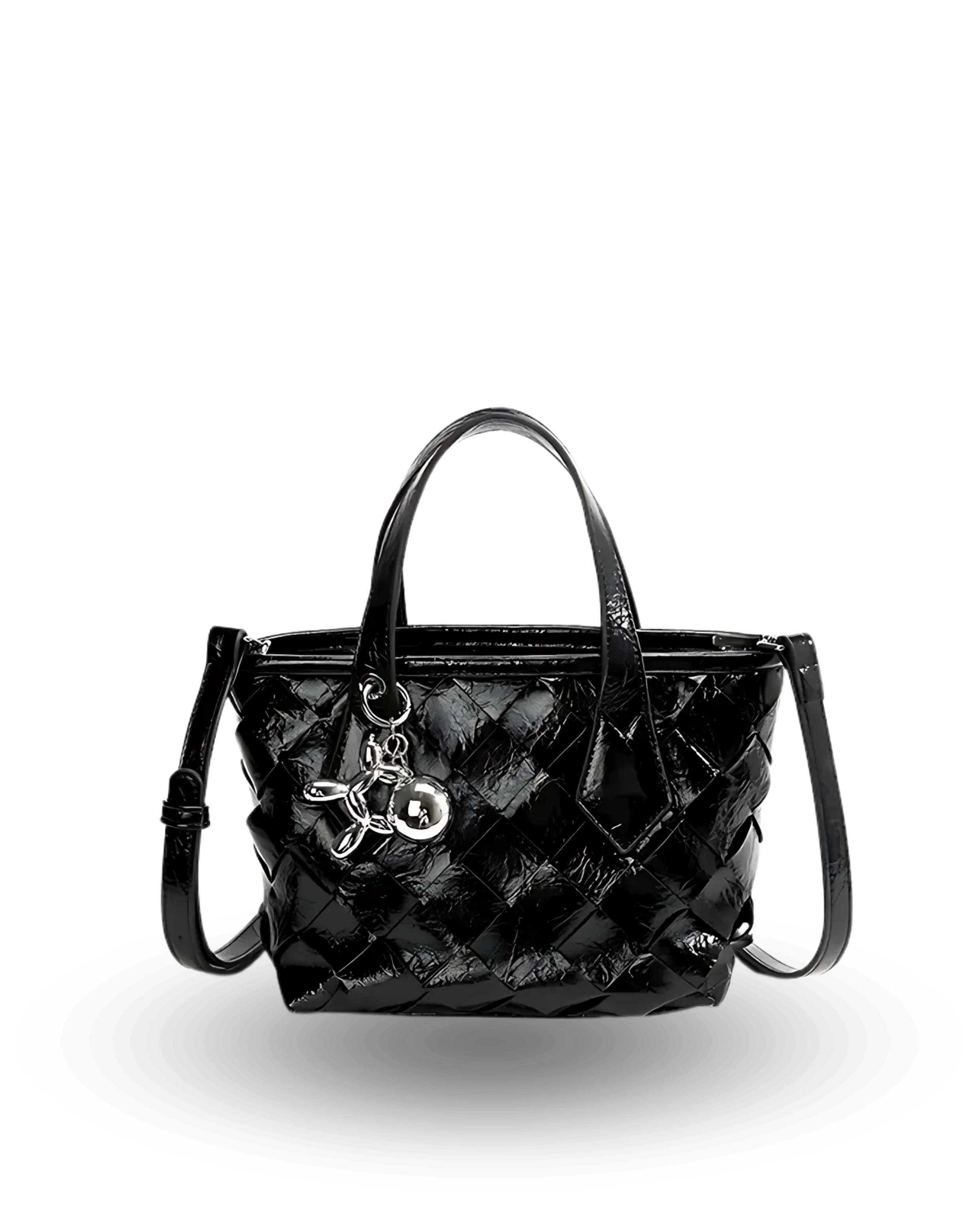 Black quilted patent leather handbag with dual top handles, detachable crossbody strap, and silver charm keychain accent.
