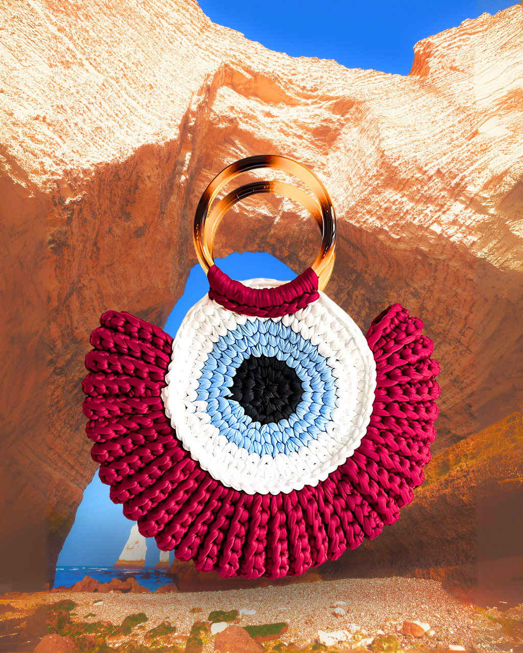 Round woven crochet handbag with layered fan-shaped black edges, evil eye design, and dual circular resin handles. rich red color eye