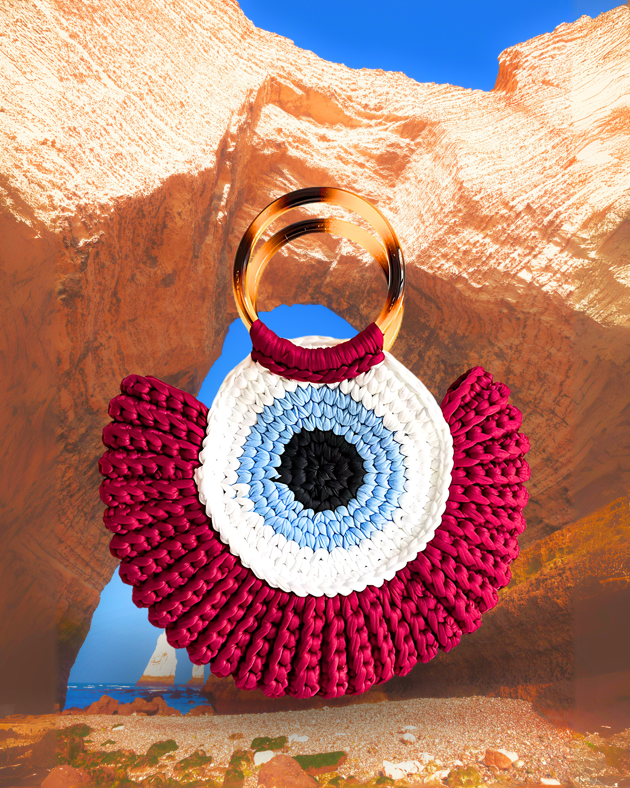 Round woven crochet handbag with layered fan-shaped black edges, evil eye design, and dual circular resin handles. rich red color eye