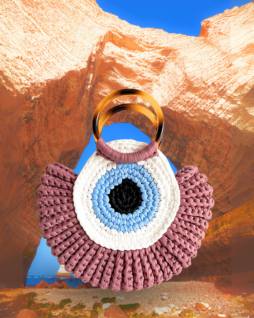 Round woven crochet handbag with layered fan-shaped black edges, evil eye design, and dual circular resin handles. dusty pink color eye