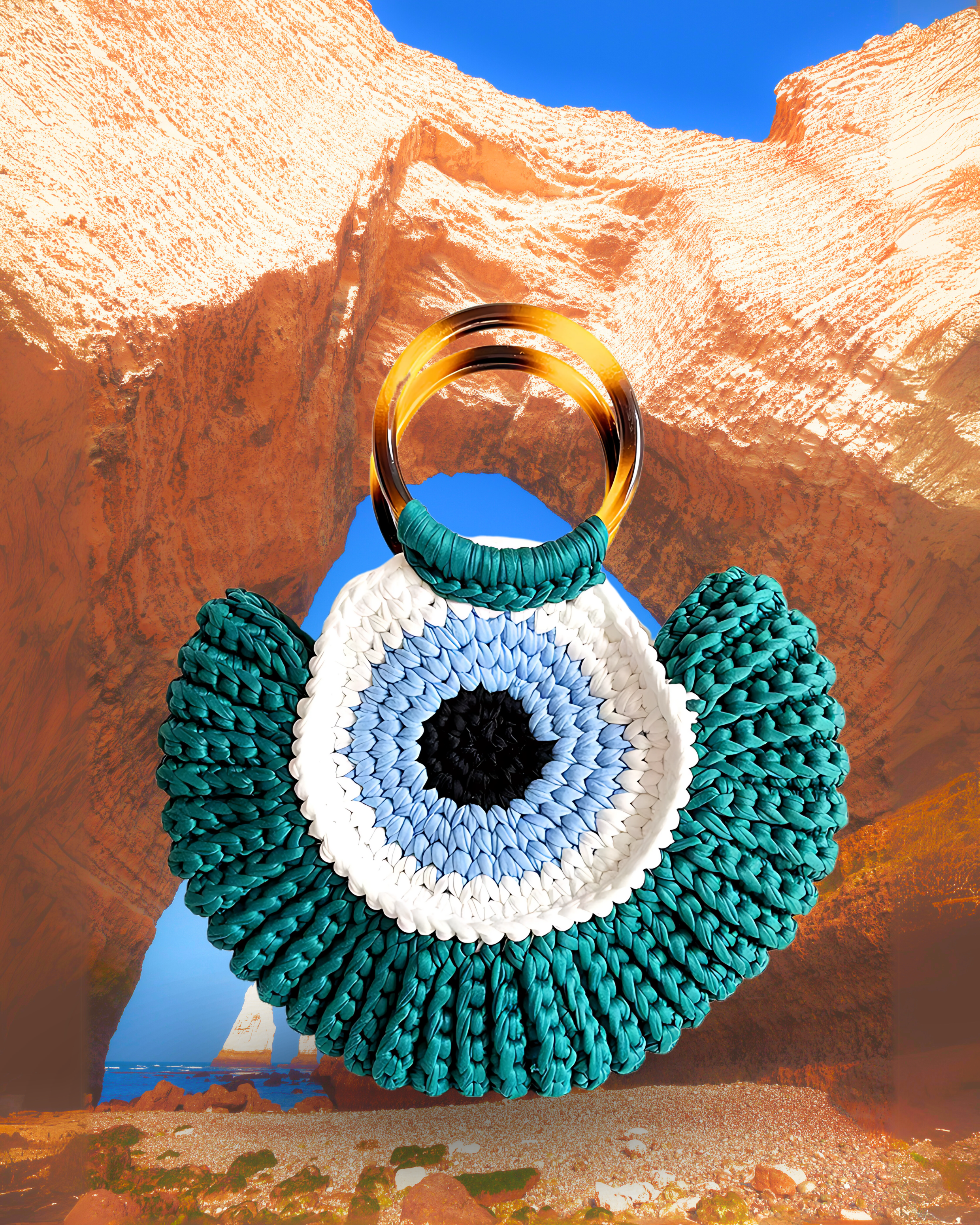 Round woven crochet handbag with layered fan-shaped black edges, evil eye design, and dual circular resin handles. Teal color eye