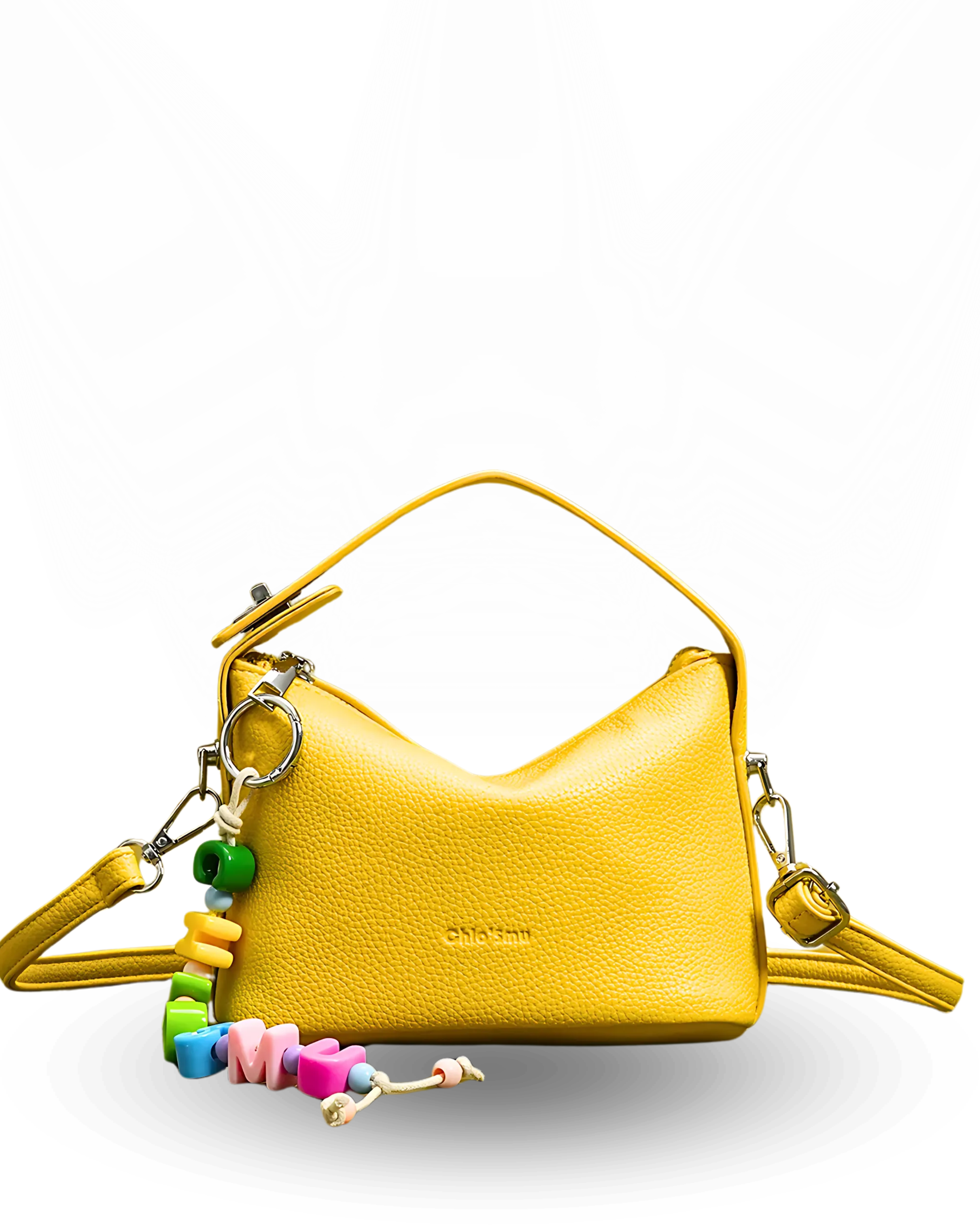 Yellow handbag with colorful keychain on a white background