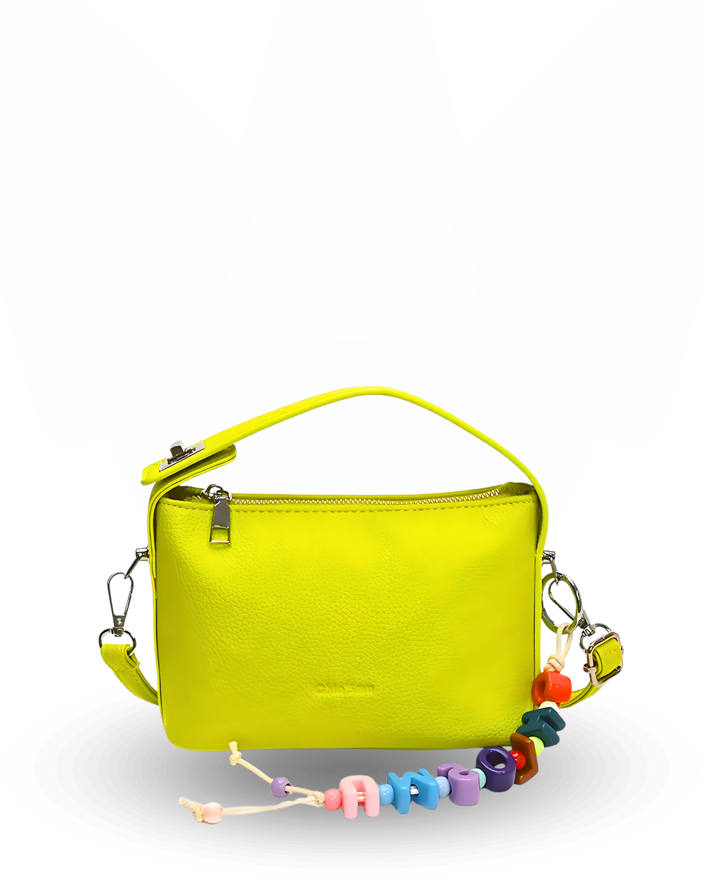 Yellow handbag with colorful beaded charm on a white background