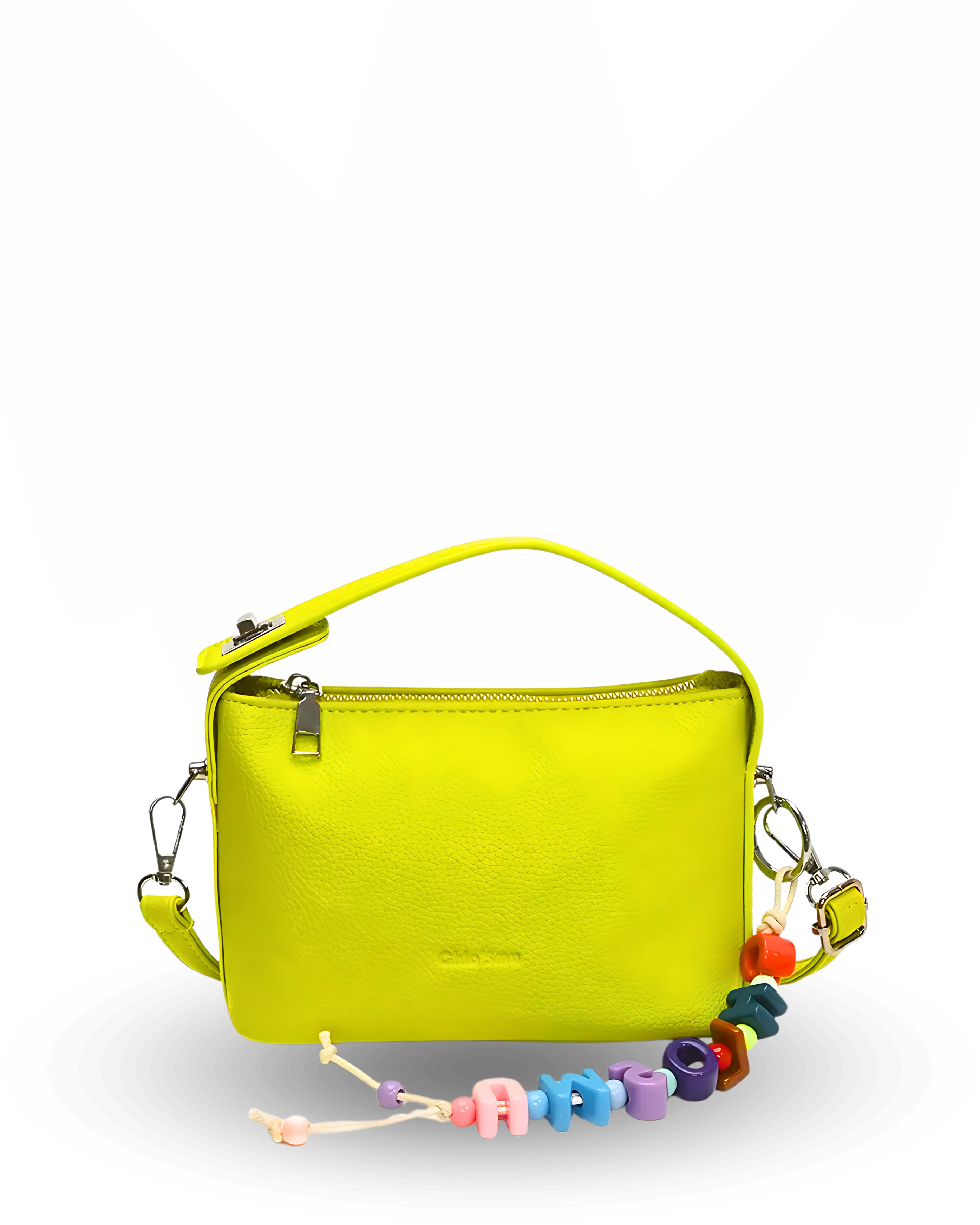Yellow handbag with colorful beaded charm on a white background