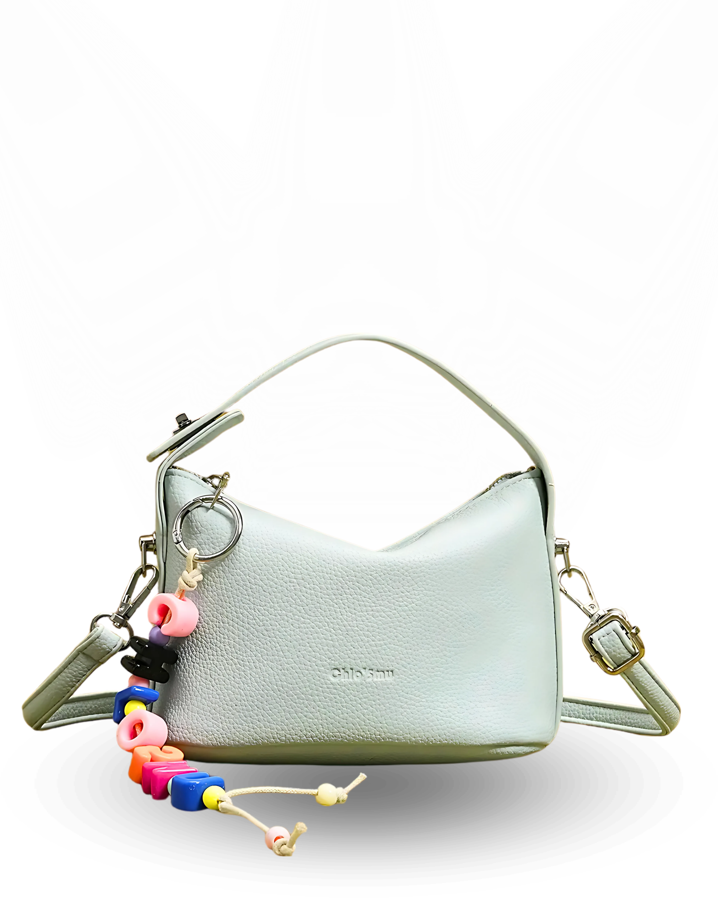 Light gray handbag with colorful keychain on a white background