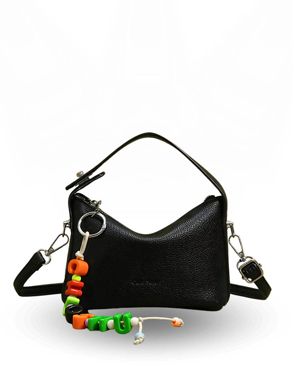 Black handbag with colorful keychain on a white background