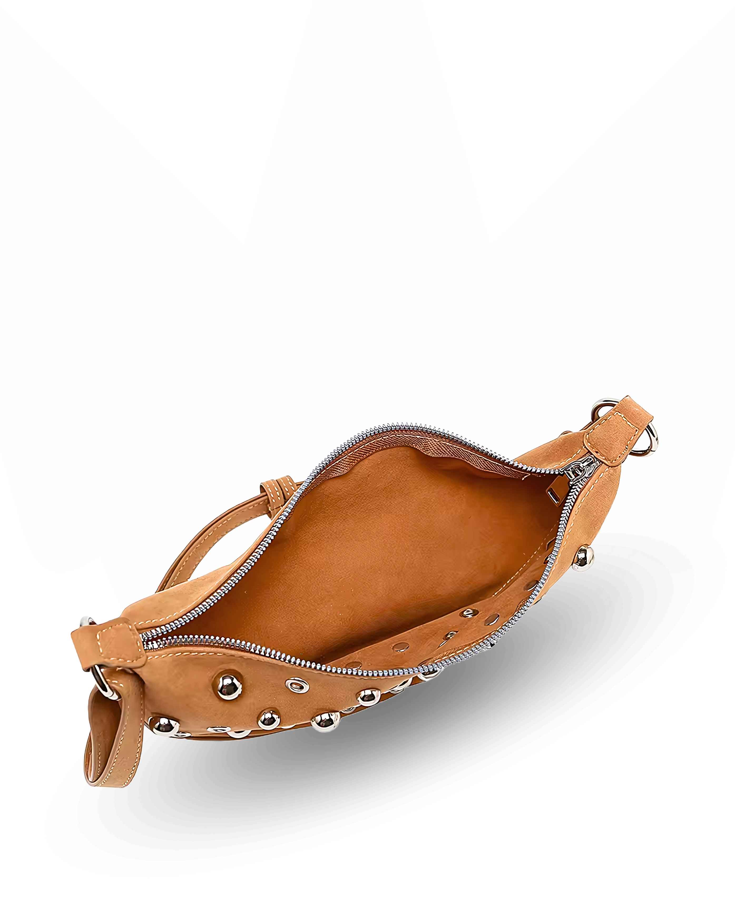 Curved crossbody sling bag made form vegan suede in autumn tan colours with a top zipper closure, adjustable shoulder strap, and metallic studded accents across the front.
