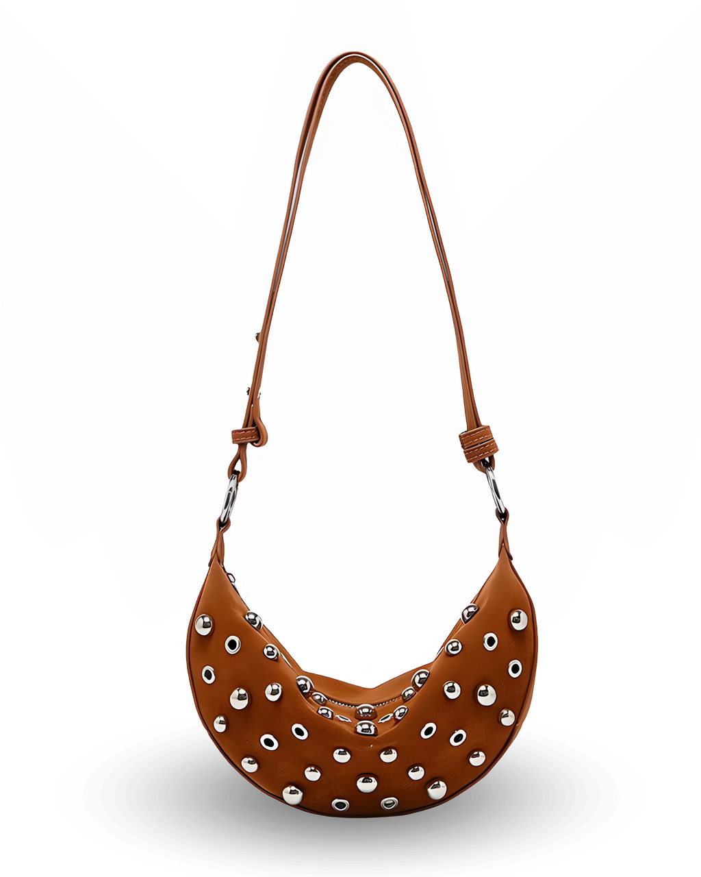 Curved crossbody sling bag made form vegan suede in autumn tan colours with a top zipper closure, adjustable shoulder strap, and metallic studded accents across the front.