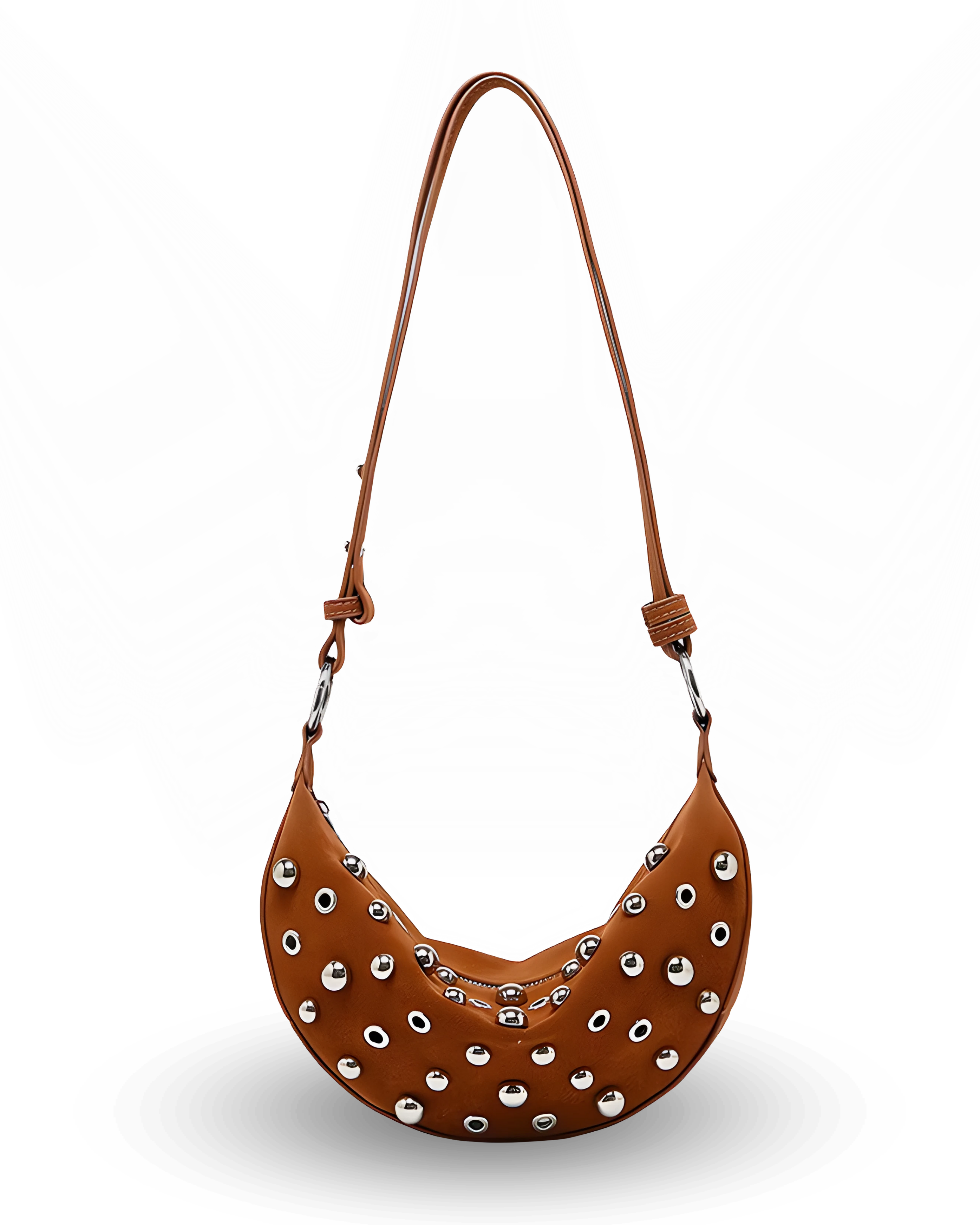 Curved crossbody sling bag made form vegan suede in autumn tan colours with a top zipper closure, adjustable shoulder strap, and metallic studded accents across the front.