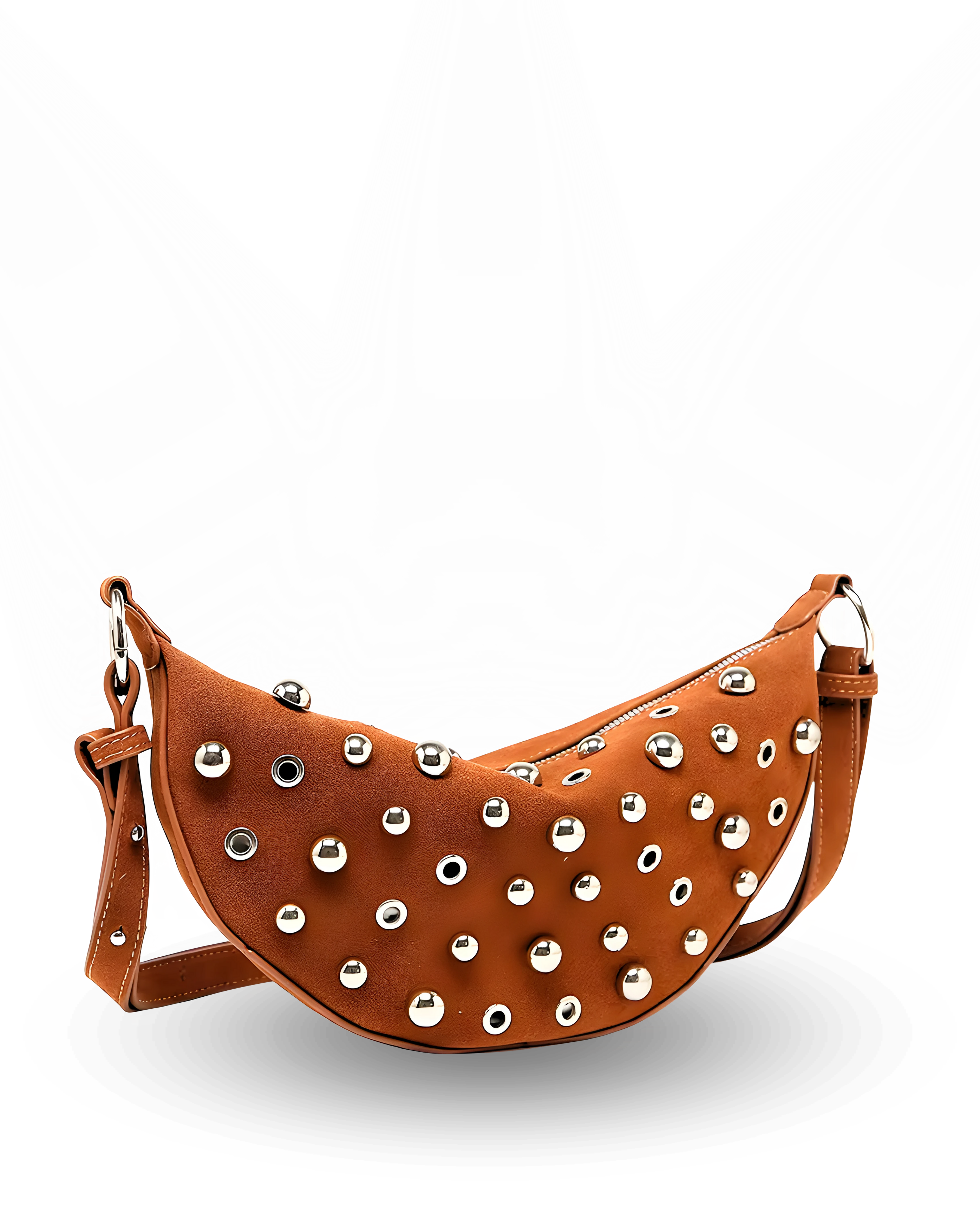 Curved crossbody sling bag made form vegan suede in autumn tan colours with a top zipper closure, adjustable shoulder strap, and metallic studded accents across the front.