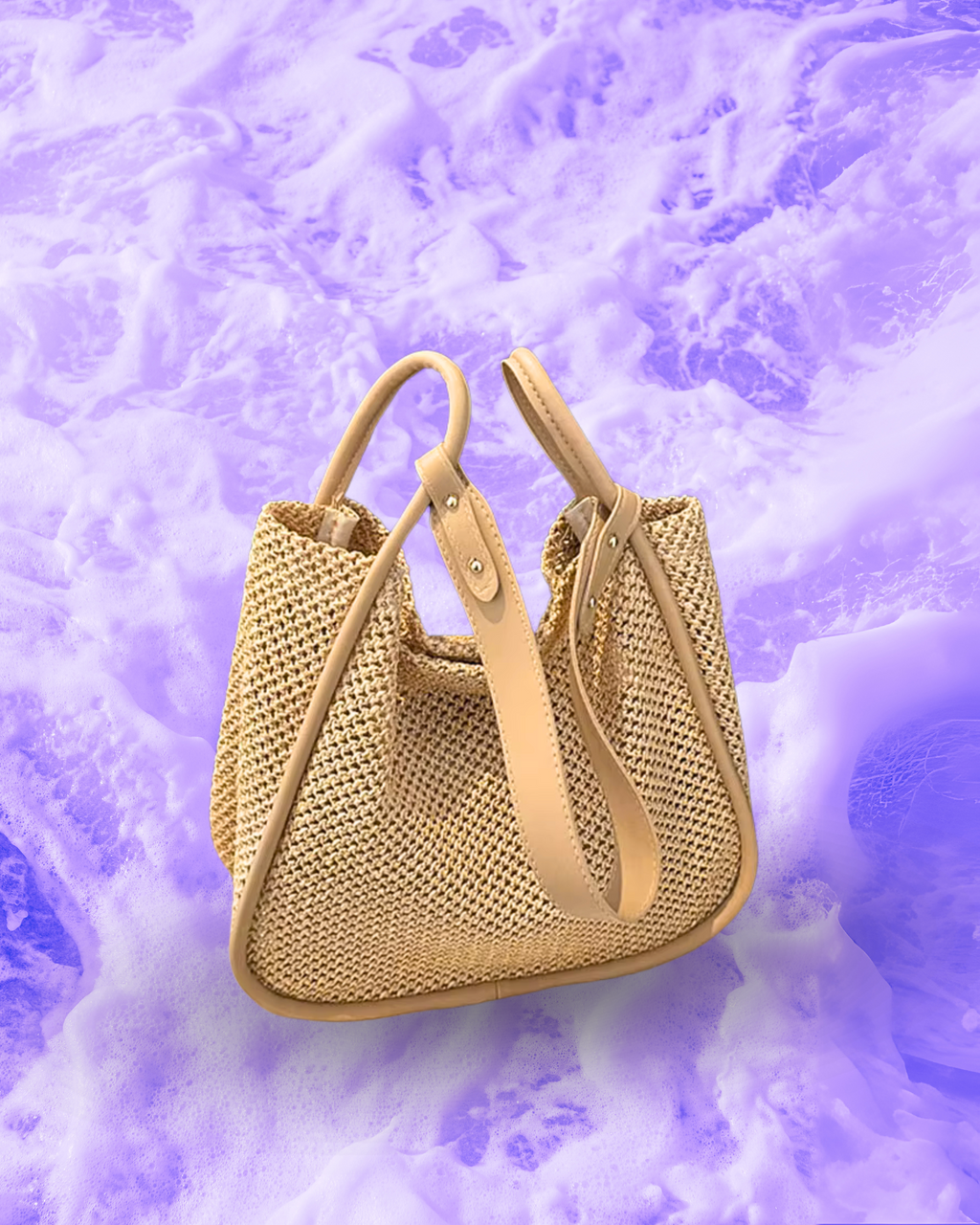 Soft rectangular woven raffia shoulder bag with a slouchy open-top design, long adjustable nude leatherette strap, and nude contrast trim framing the edges.