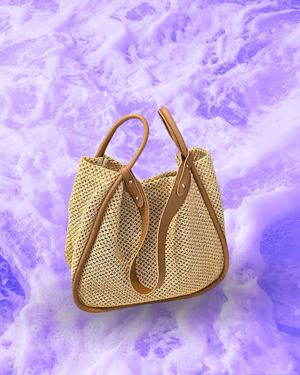 Soft rectangular woven raffia shoulder bag with a slouchy open-top design, long adjustable brown leatherette strap, and brown contrast trim framing the edges.