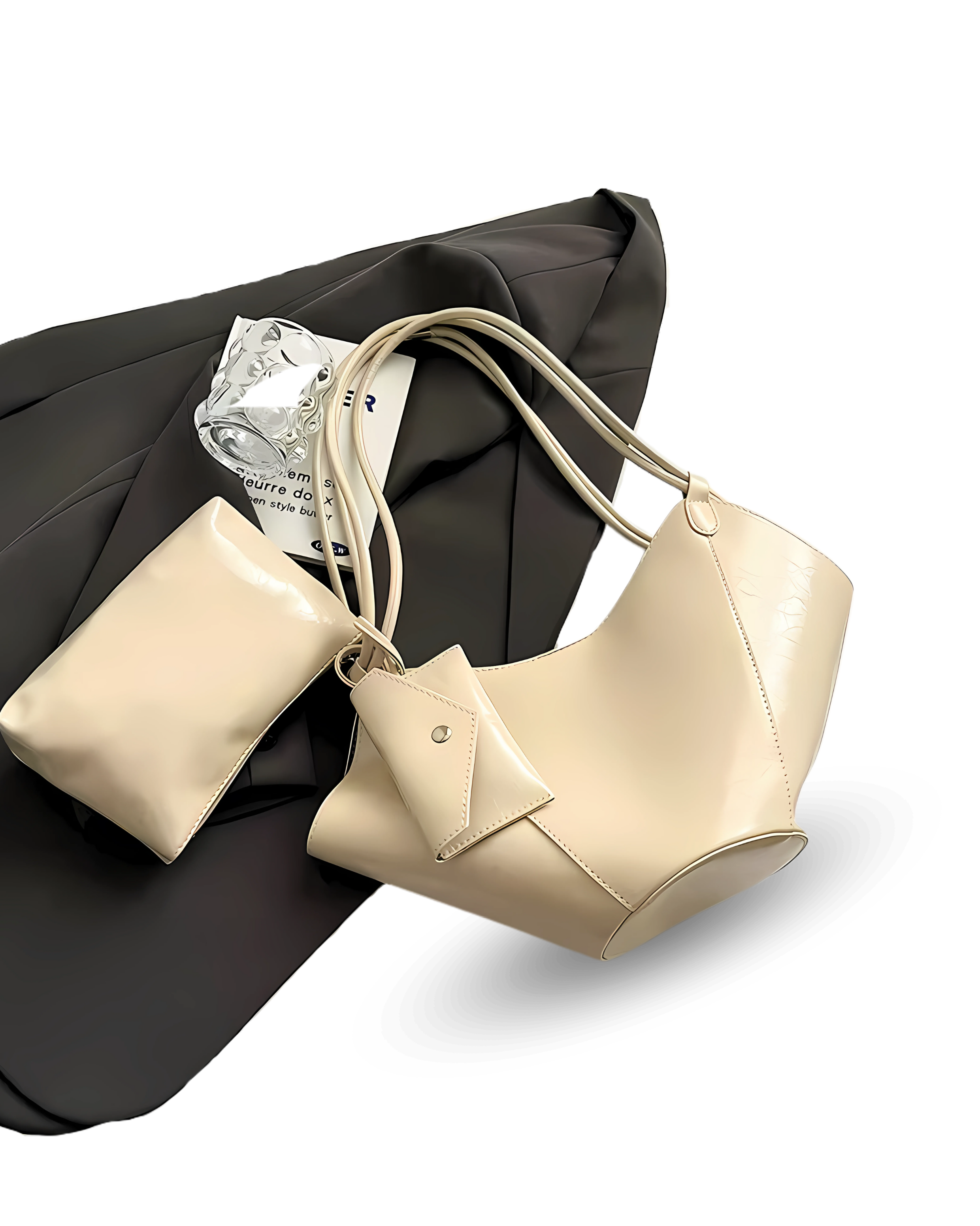 Unique cream vegan leather handbag with sculpted, winged sides, dual shoulder straps, and a matching pouch accessory