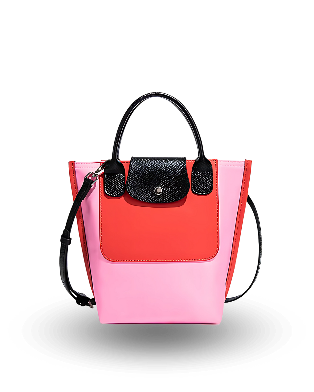 Two-toned pink and red handbag with black accents on a white background