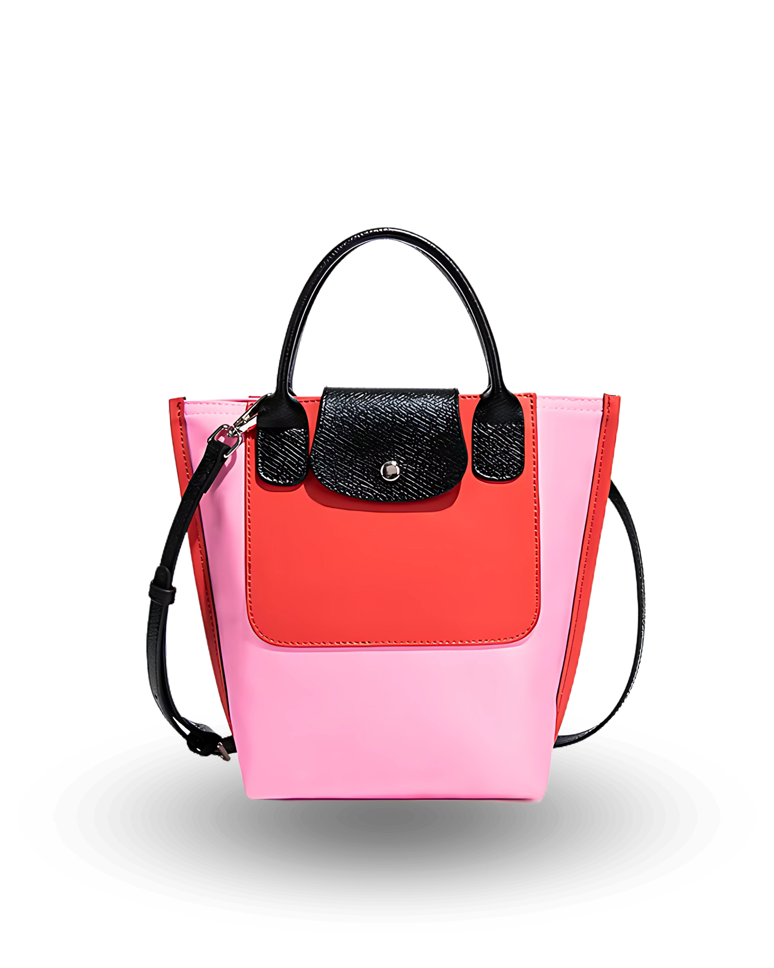 Two-toned pink and red handbag with black accents on a white background