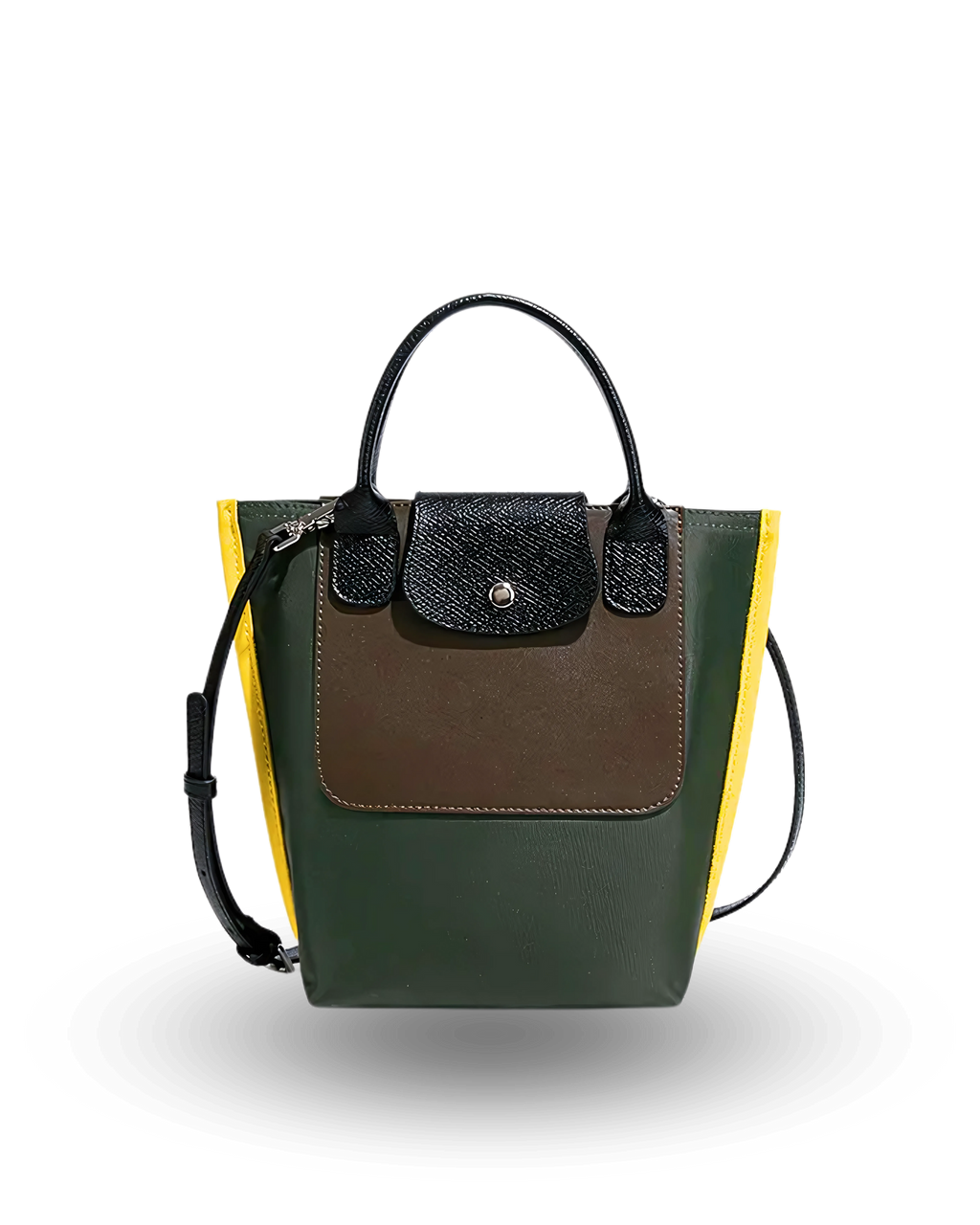 Mini tote crossbody handbag with a structured design, featuring a dark green body, brown front pocket, black textured flap with silver button, yellow side panels, and black top handles with adjustable shoulder strap.