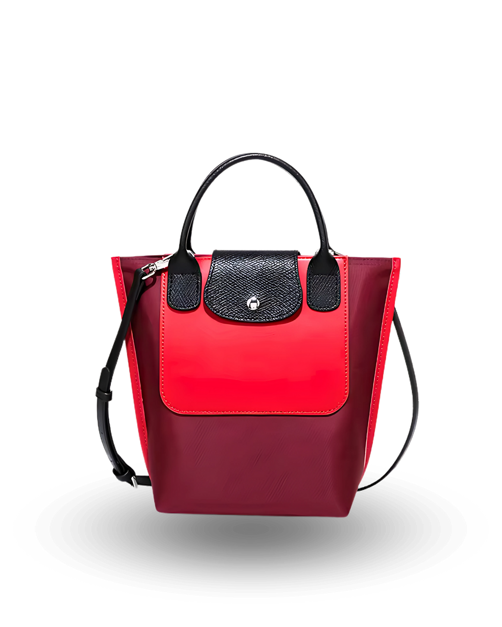 Red and black mini tote bag with top handles, crossbody strap, and front flap closure, made of vegan materials