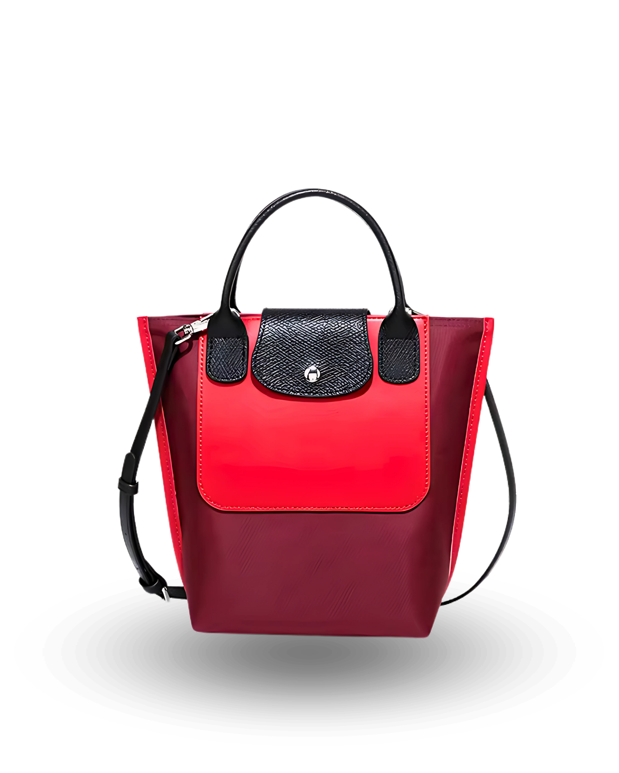 Red and black mini tote bag with top handles, crossbody strap, and front flap closure, made of vegan materials