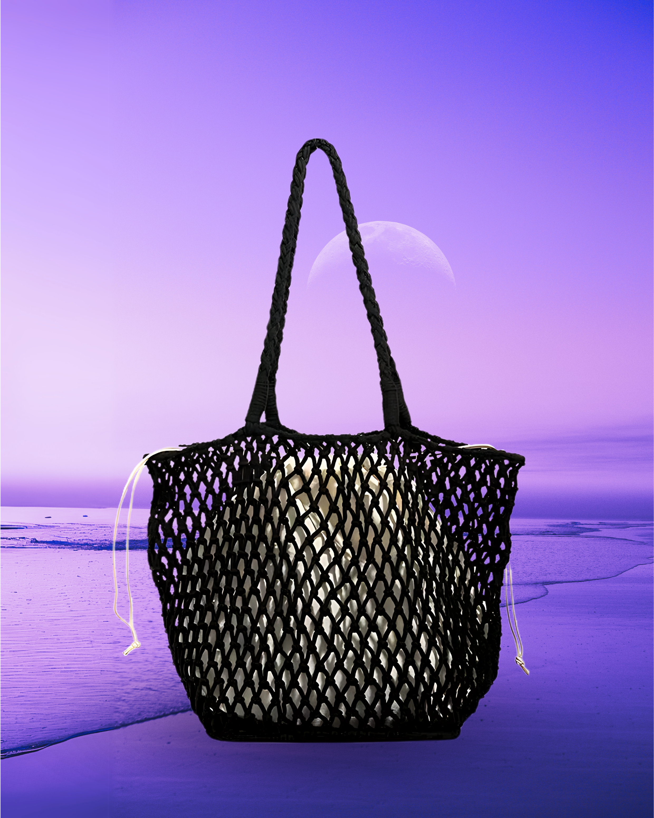Square-shaped black macramé net tote bag with an open woven design, rounded corners, braided shoulder straps, and a drawstring inner pouch.