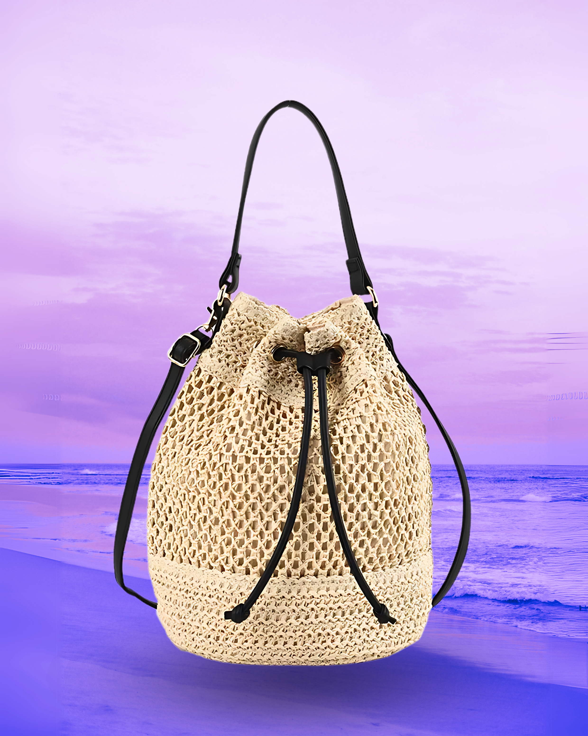 Tall cylindrical woven straw bucket bag with a flat base, open-top drawstring closure, and dual brown leather straps for shoulder or crossbody wear.